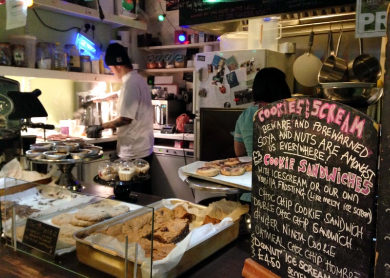 Kitchen counter with two people preparing baked goods.