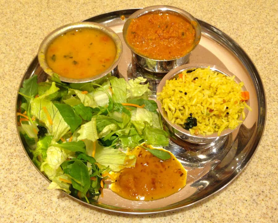 Curry with rice, salad and dhal.