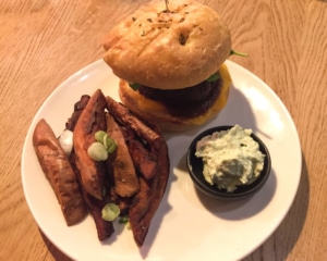 Burger with chips and side of mayo.