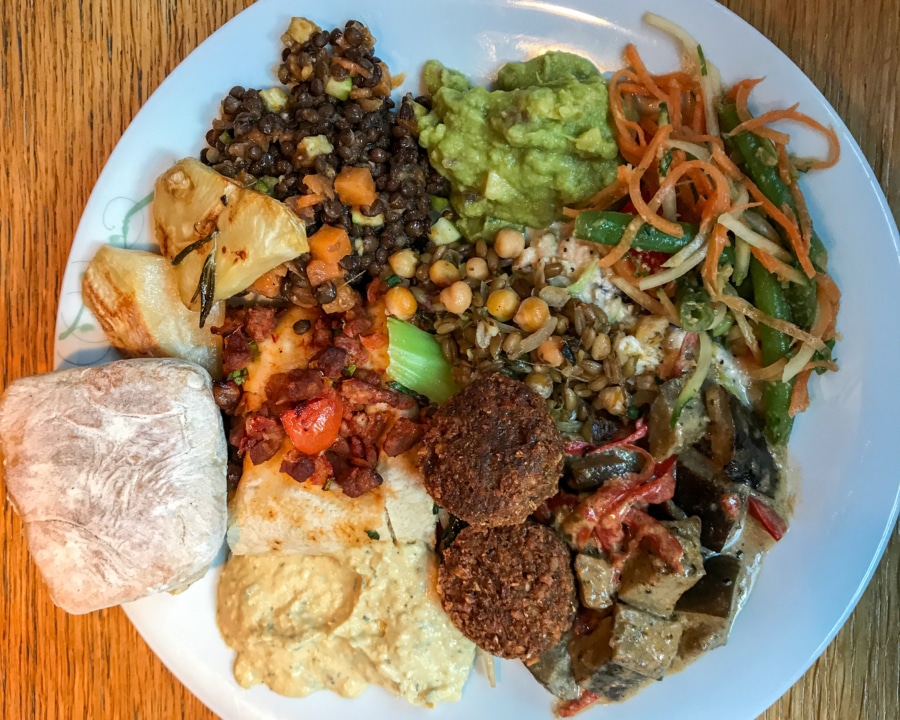 Falafel, samosa and a mix of hot and cold vegetarian salads with bread.