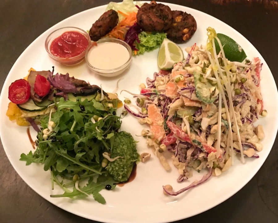 Polenta tart with corn fritters and side salads.