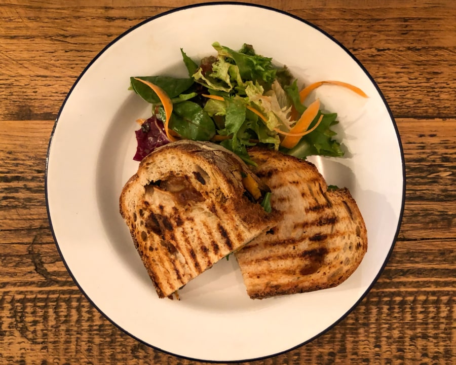 Roasted pepper, aubergine and peanut butter grilled sandwich with salad.